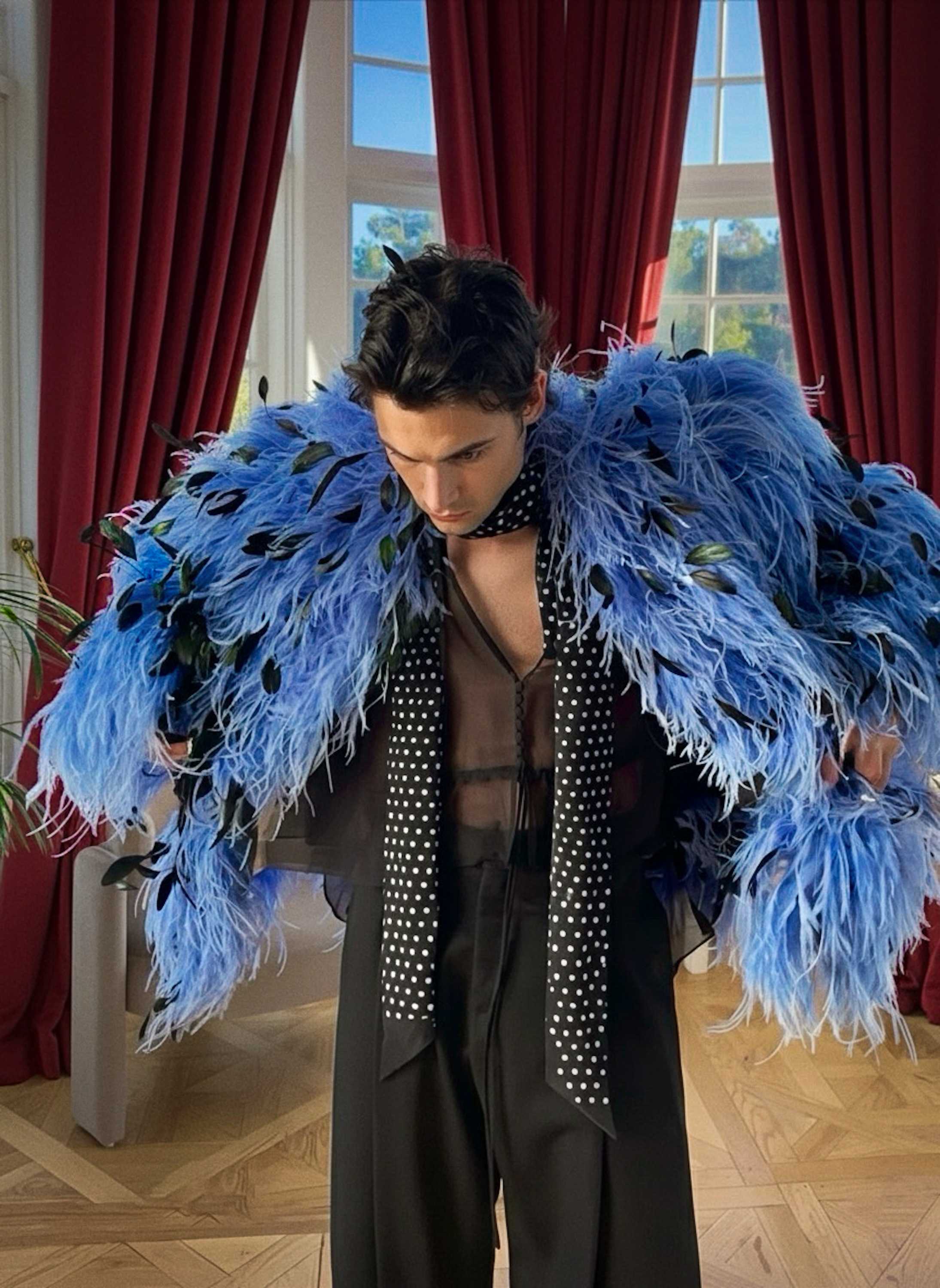 long-lens paparazzi capture of Damon Cael in bold couture walking through the city, rising pop artist Damon Cael.