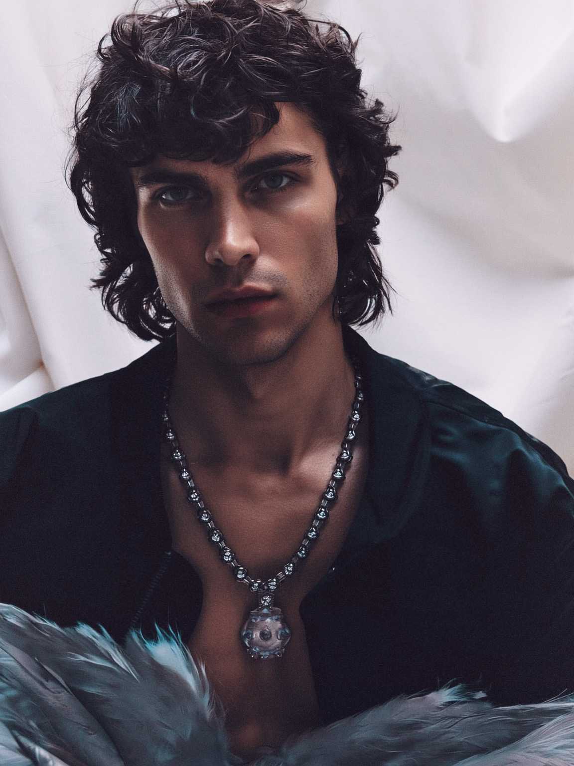 press-feeling candid of Damon Cael framed against dark brick walls, rising pop artist Damon Cael.