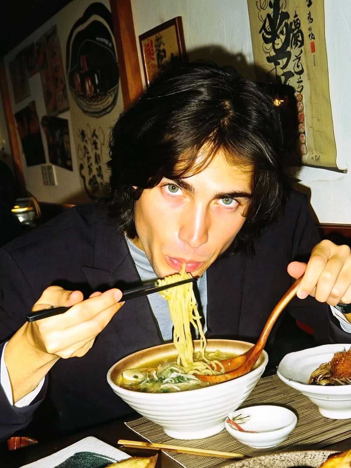 telephoto candid of Damon Cael in muted tonal couture, rising pop artist Damon Cael.