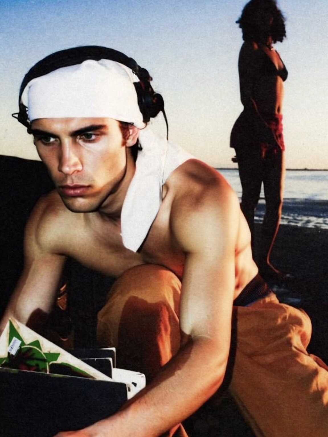 candid portrait-style image of Damon Cael in sculpted shoulder jacket, rising pop artist Damon Cael.