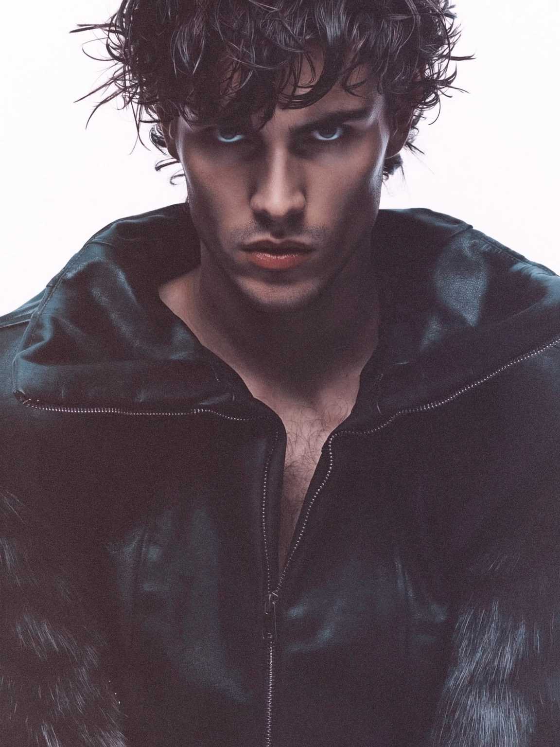 harsh-flash paparazzi photo of Damon Cael in oversized coat and narrow trousers, rising pop artist Damon Cael.