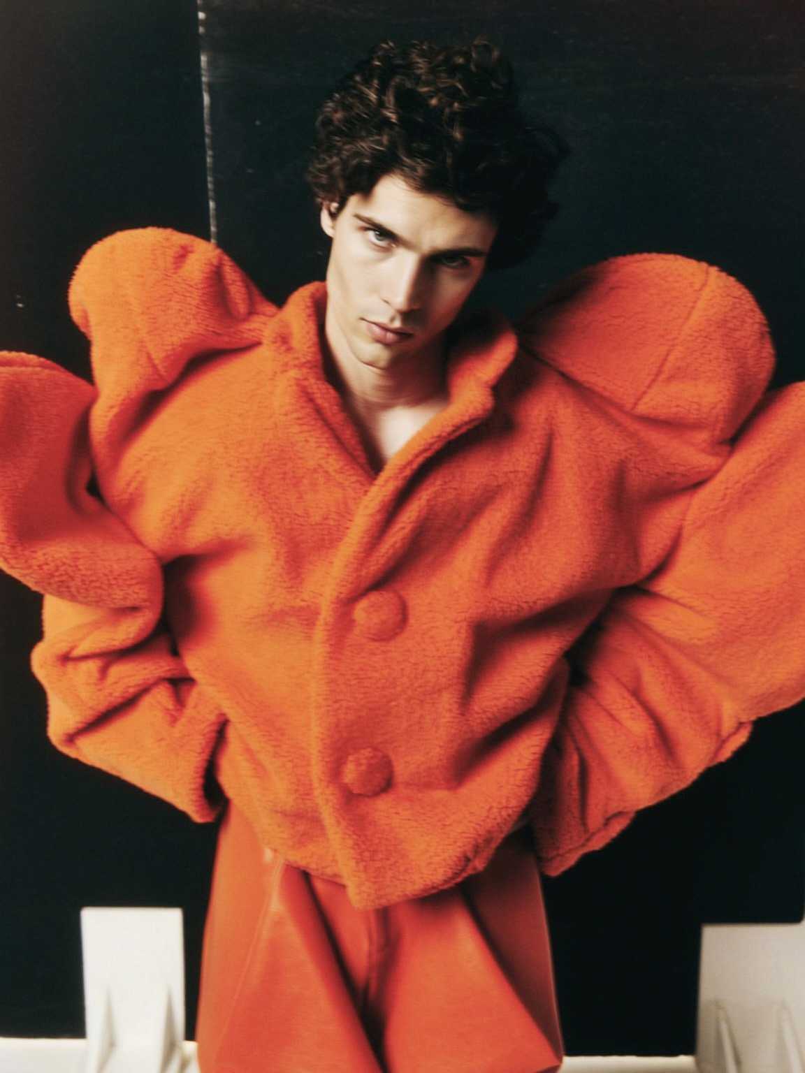 candid detail-focused frame of Damon Cael’s outfit and posture, rising pop artist Damon Cael.