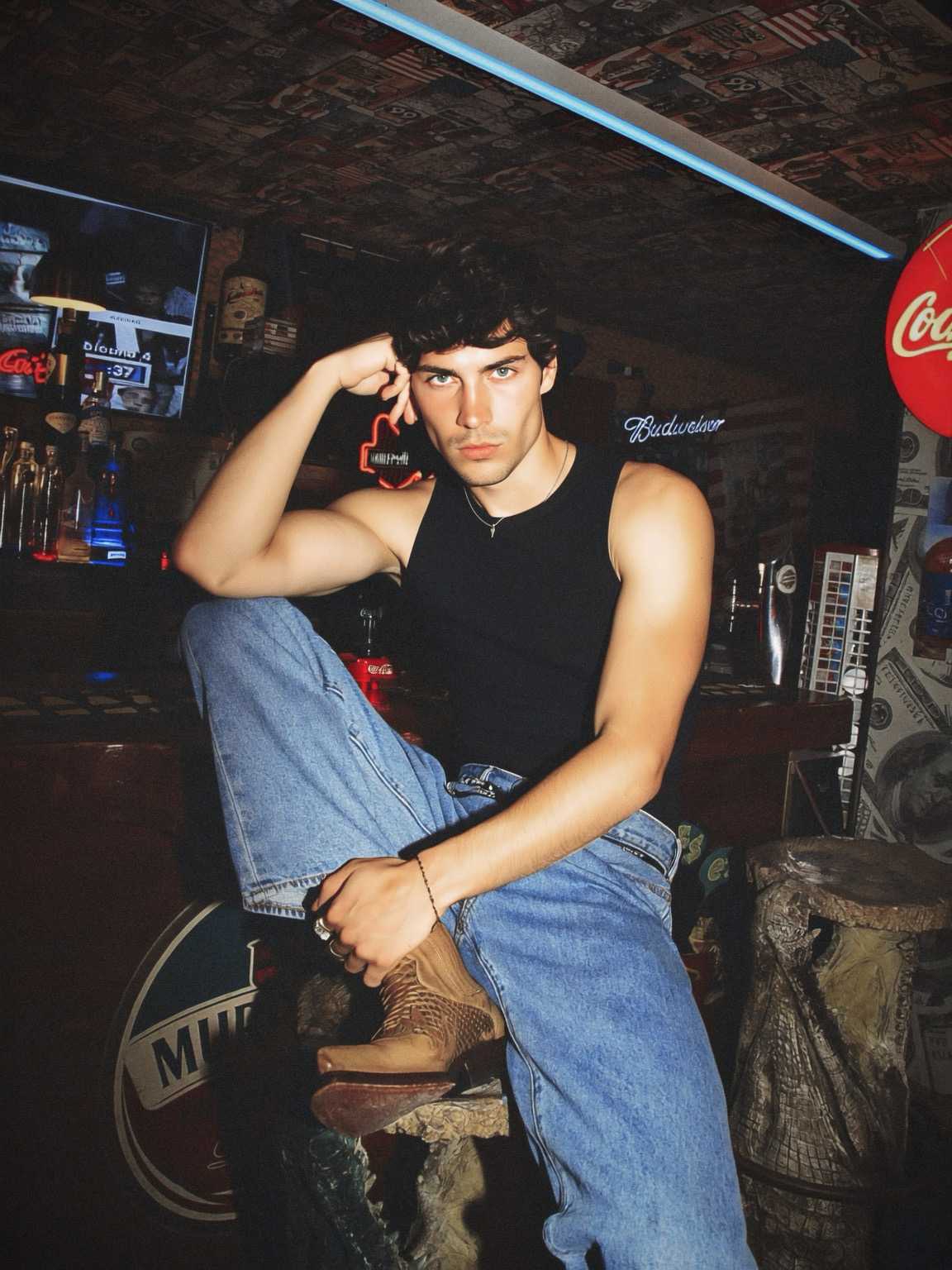 low-angle candid of Damon Cael in bold-shouldered couture, rising pop artist Damon Cael.